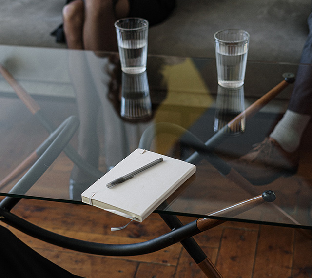 Tablet and Pen on table in front of couple