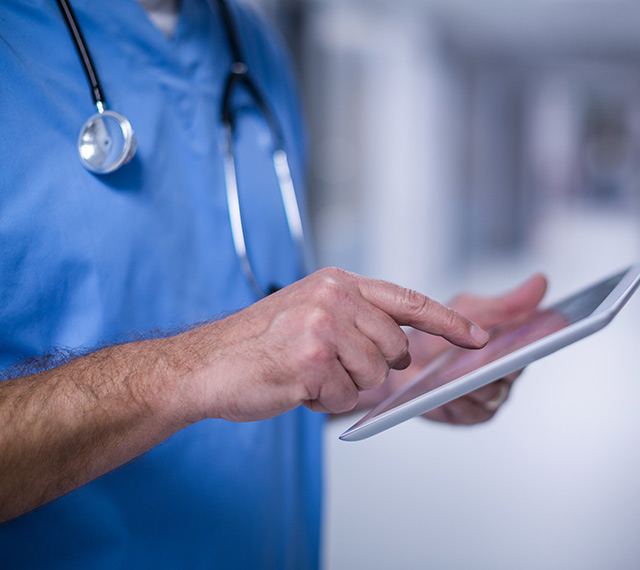 Healthcare worker holding iPad